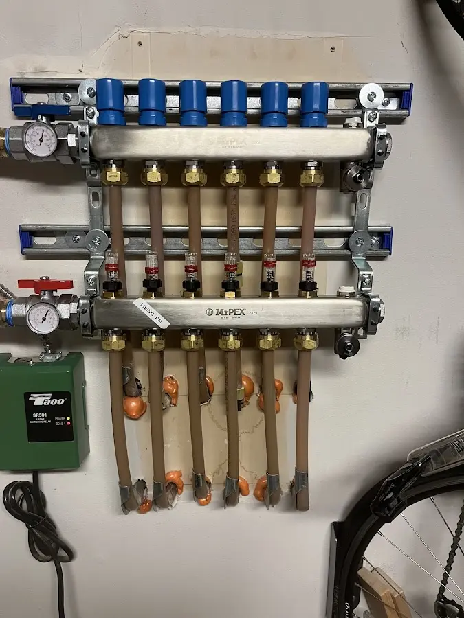 Plumber performing Water Heater Repair at a residential property in Delano